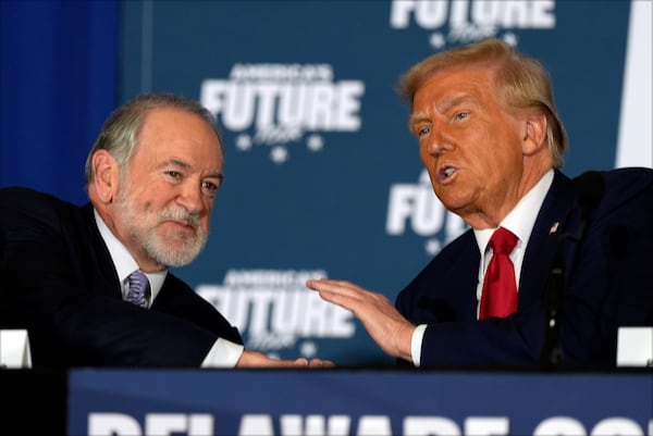 Republican presidential nominee former President Donald Trump talks with former Arkansas Gov. Mike Huckabee during a roundtable at the Drexelbrook Catering & Event Center, Tuesday, Oct. 29, 2024, in Drexel Hill, Pa. (AP Photo/Julia Demaree Nikhinson)