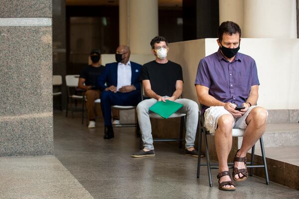 The Fulton County Government Center was sporadically bustling in downtown Atlanta, Georgia, on Monday, June 29, 2020. All visitors and employees entering the Fulton County Government Center were told to wear a mask, practice social distancing, and they had their temperature checked before entering the building in an attempt to decrease the spread of COVID-19. (REBECCA WRIGHT FOR THE ATLANTA JOURNAL-CONSTITUTION)