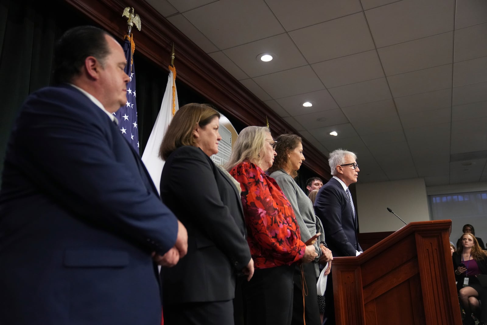 Los Angeles County District Attorney George Gascon, right, flanked by Menendez family members, speaks during a news conference at the Hall of Justice, Thursday, Oct. 24, 2024, in Los Angeles. (AP Photo/Eric Thayer)