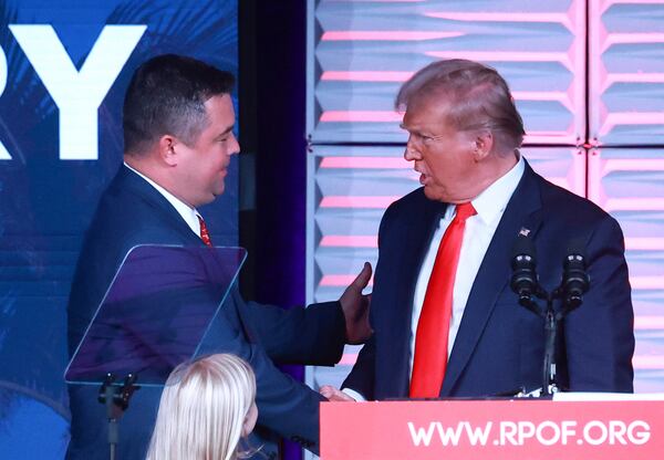 In this Nov. 4, 2023, file photo, Republican Party of Florida chairman Christian Ziegler, left, greets former president Donald Trump at the RPOF Freedom Summit in Kissimmee, Florida. The Florida GOP chair is accused of sexual battery in a report published Thursday, Nov. 30, 2023.  Ziegler has not been charged with any crime and maintains his innocence, contending the encounter was consensual. (Joe Burbank/Orlando Sentinel/TNS)