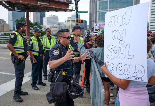 Police briefly blocked crowds from moving between Mercedes-Benz Stadium and Centennial Olympic Park.