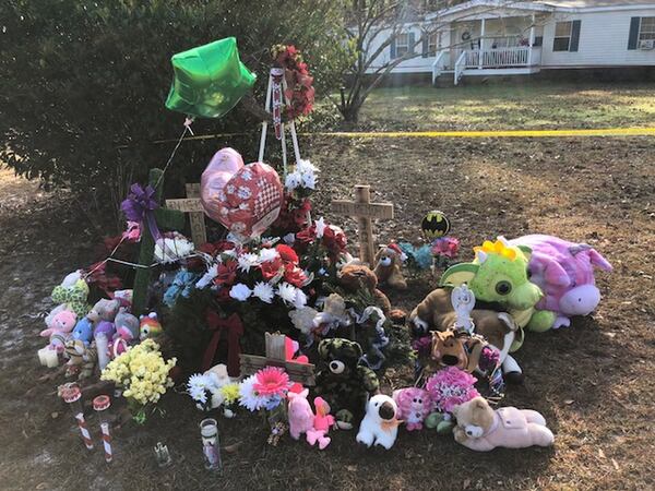 A memorial outside the Effingham County home where two children were found buried in the backyard on Dec. 20. (Joshua Sharpe, AJC staff/Joshua.sharpe@ajc.com)