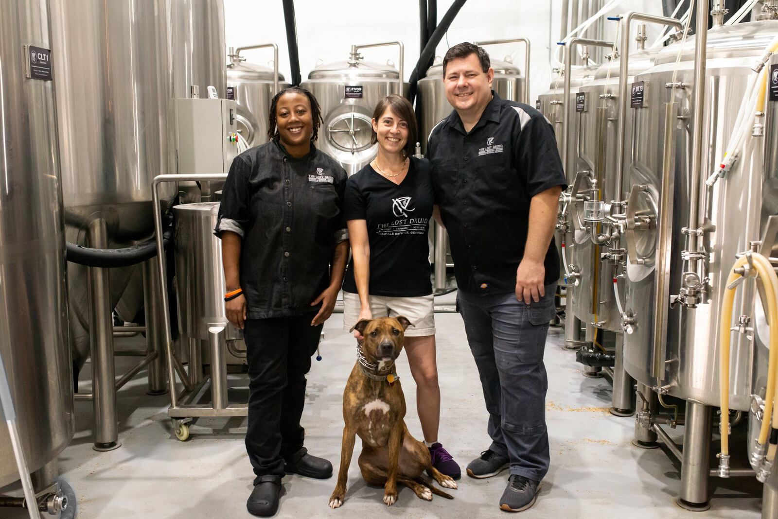 The Lost Druid team (from left) includes Executive Chef Chantel Mines, owners Stacia Familo-Hopek and Robert Hopek, and Roxy the brew dog. Mia Yakel for The Atlanta Journal-Constitution