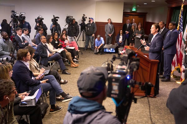 Los Angeles County District Attorney Nathan Hochman, at podium, speaks during a news conference in downtown Los Angeles, Monday. March 10, 2025. (AP Photo/Damian Dovarganes)