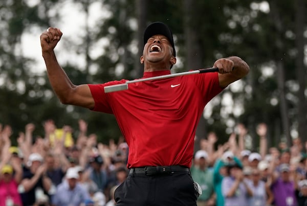 FILE - In this April 14, 2019, file photo, Tiger Woods reacts as he wins the Masters golf tournament at Augusta National in Augusta, Ga. (AP Photo/David J. Phillip, File)