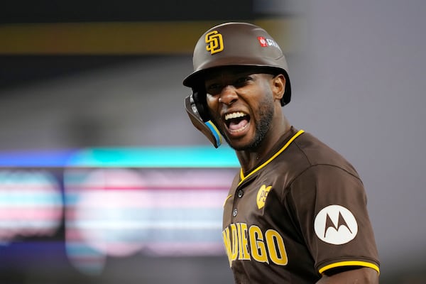 Jurickson Profar celebrates a bunt single during a Padres playoff game against the Dodgers.