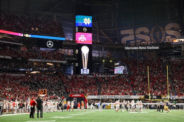 Fans celebrate the start of the fourth quarter during the game between Ohio State and Notre Dame in the 2025 National Championship at Mercedes-Benz Stadium, Monday, Jan. 20, 2025, in Atlanta. Ohio State won 34-23. (Jason Getz / AJC)