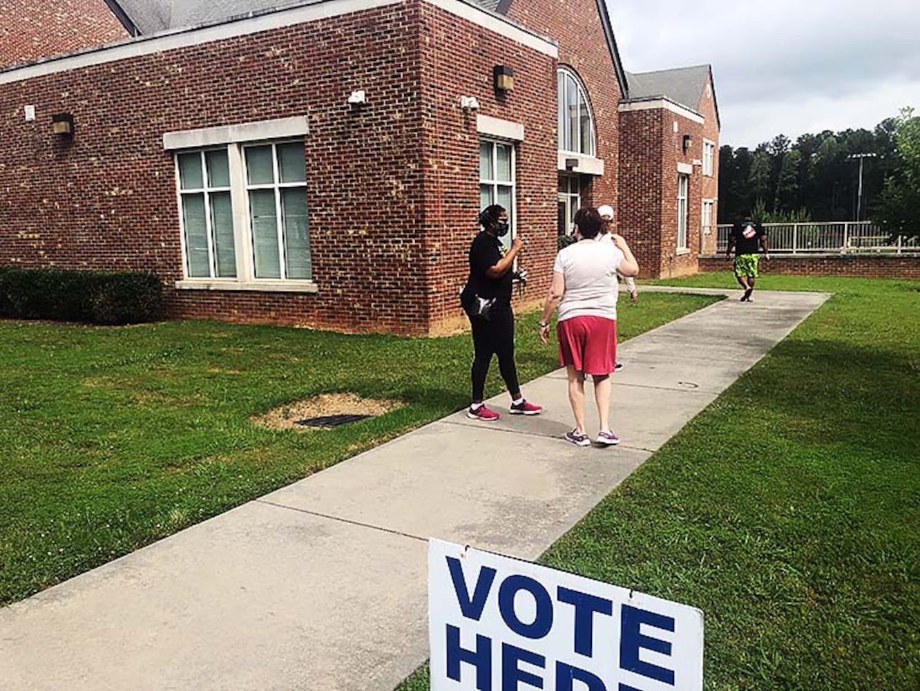 PHOTOS: Georgia voters struggle with long lines, new equipment, social distancing