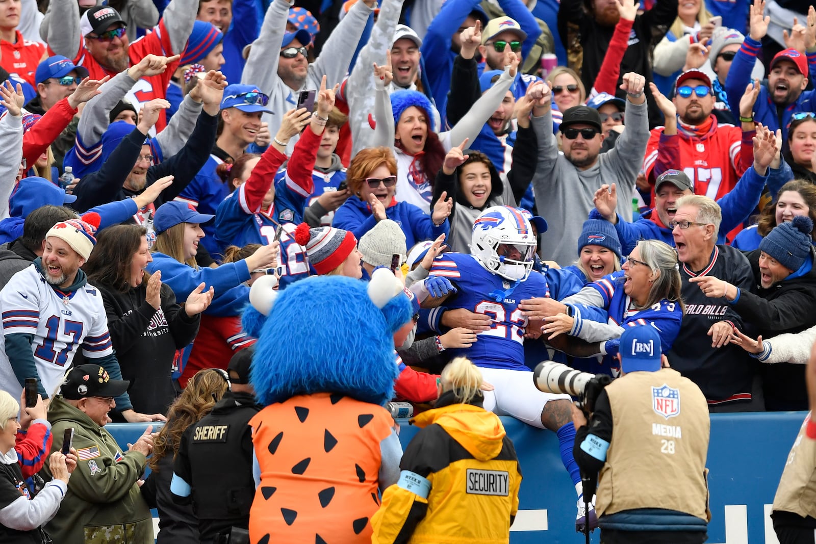 Buffalo Bills running back Ray Davis (22) jumps into the stands after scoring a touchdown during the second half of an NFL football game against the Miami Dolphins, Sunday, Nov. 3, 2024, in Orchard Park, N.Y. (AP Photo/Adrian Kraus)