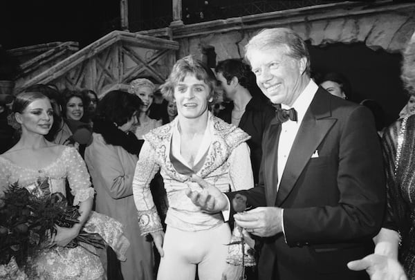 President Jimmy Carter congratulates Mikhail Baryshnikov in 1978 at the Kennedy Center in Washington, D.C., following the world premiere of "Don Quixote." AP Photo: Charles W. Harrity