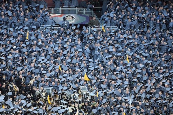 Cadets celebrate during the first half of an NCAA college football game against Navy, Saturday, Dec. 14, 2024, in Landover, Md. (AP Photo/Daniel Kucin Jr.)