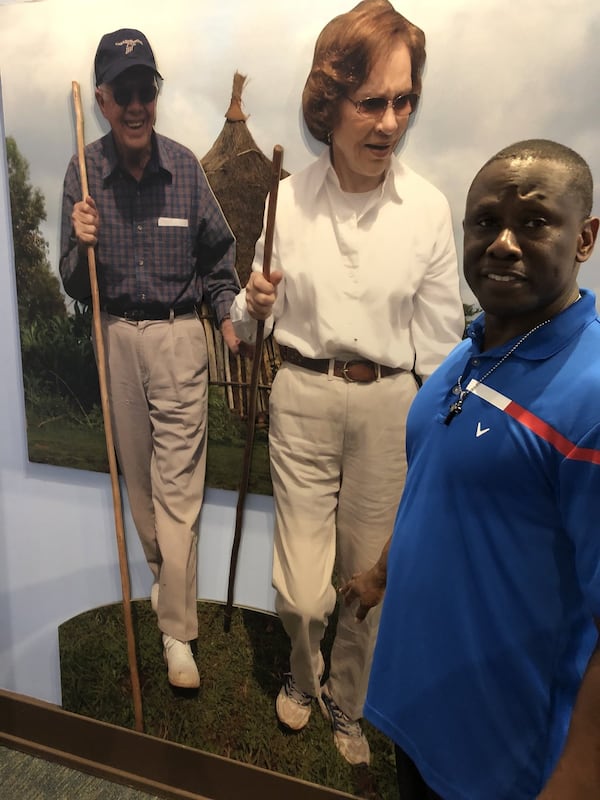 Maranatha Baptist Church pastor Tony Lowden, in front of life-size images of President Jimmy Carter and Rosalynn Carter at the Jimmy Carter National Historic Site in Plains. Lowden preaches to Maranatha visitors that coming there is not just about meeting President Carter. “To know the man,” he said, “you gotta know his spirit. You can’t have Jesus in your heart without love.”