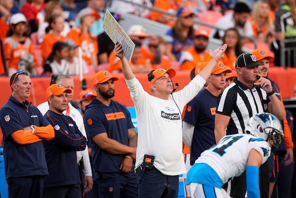 Denver Broncos head coach Sean Payton argues for a call late in the second half of an NFL football game against the Carolina Panthers, Sunday, Oct. 27, 2024, in Denver. (AP Photo/David Zalubowski)