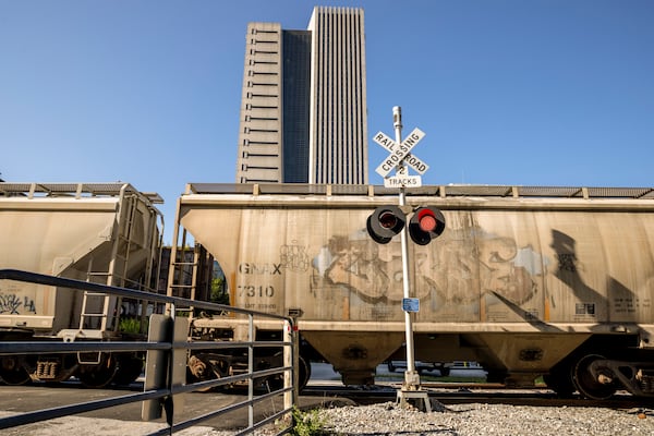 A freight train crossing in Atlanta, Ga. on Thursday, Sept. 15, 2022. Freight rail companies and unions representing tens of thousands of workers reached a tentative agreement to avoid what would have been an economically damaging strike, after all-night talks brokered by Labor Secretary Martin J. Walsh, President Biden said early Thursday morning. (Dustin Chambers/The New York Times)