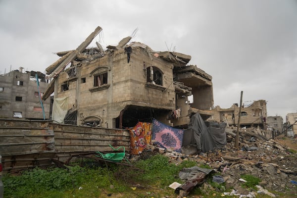 A four-story home belonging to the Tamboura family, which was struck by an Israeli airstrike on Oct. 20, 2023, stands in ruins in Beit Lahiya, northern Gaza Strip, Friday, Feb. 21, 2025. (AP Photo/Abdel Kareem Hana)