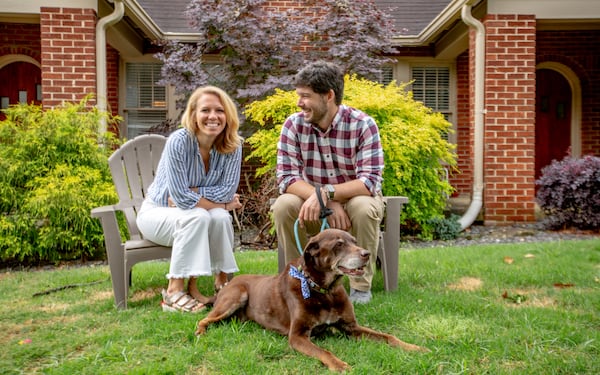 Jille Natalino and Adam Michaels are purchasing their first home together in Atlanta's Morningside neighborhood and are relocating from San Diego. The newly engaged couple is trying to decide what color to paint the trim on the house.  (Jenni Girtman for The Atlanta Journal-Constitution)