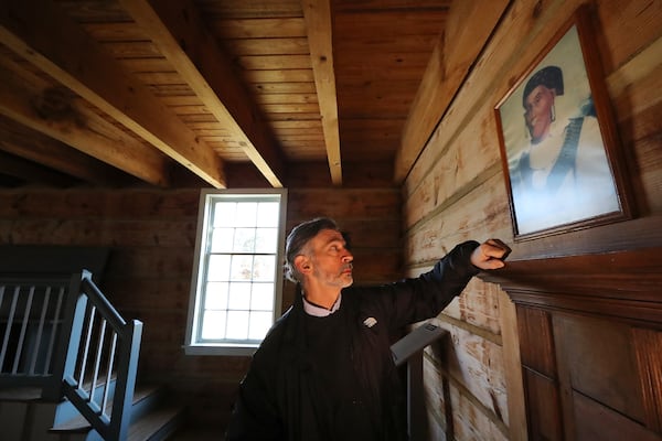 Cherokee Indian descendant John Perry tours the Council House where a portrait of his 5th great grandfather George Lowery hangs at New Echota Historic Site on Tuesday, Dec. 8, 2020, in Calhoun. New Echota is one of the most significant Cherokee Indian sites in the nation and marks the beginning of the tragic Trail of Tears.   Curtis Compton / Curtis.Compton@ajc.com