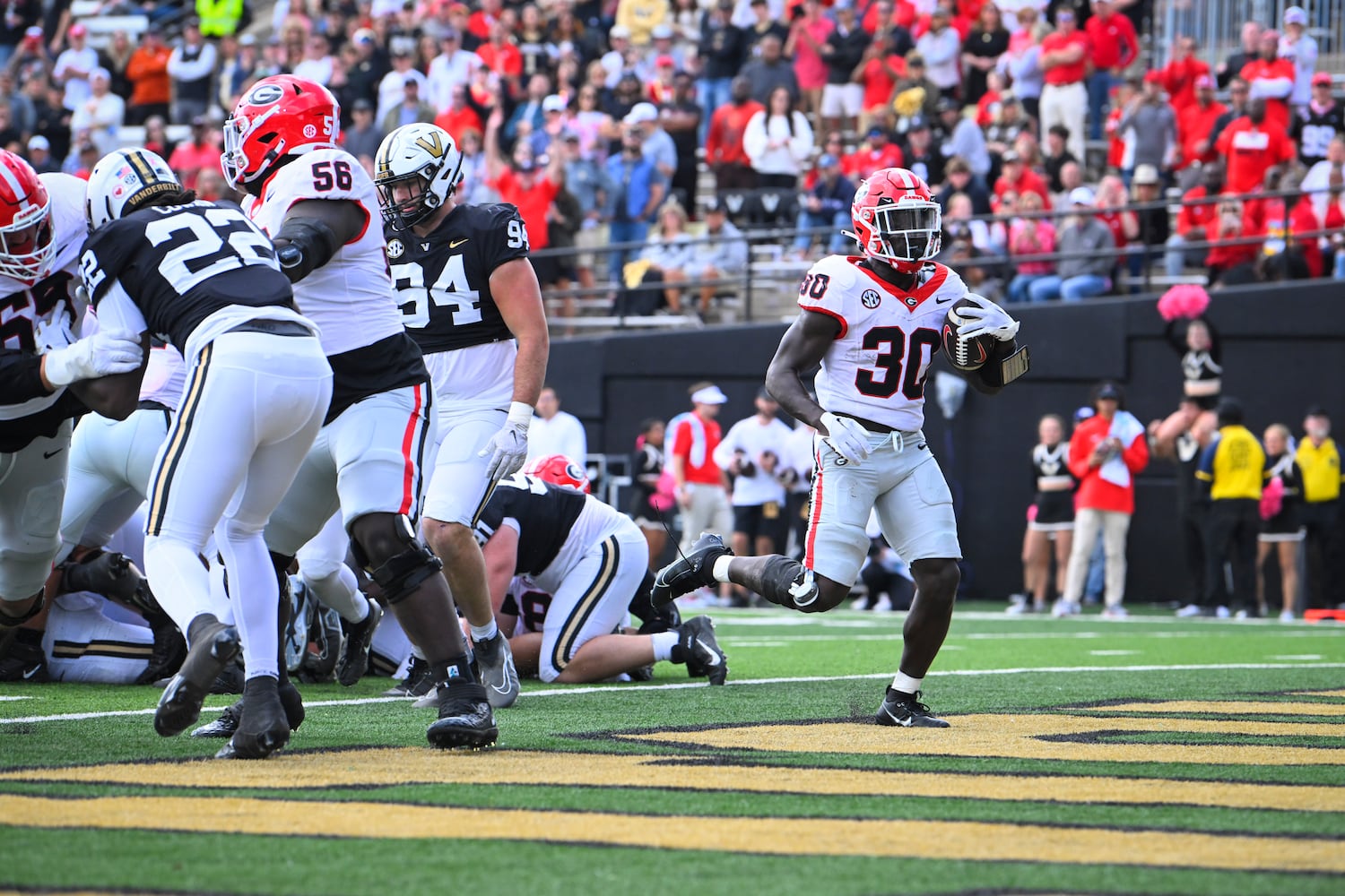 Georgia running back Daijun Edwards (30) sccores against Vanderbilt during the second half of an NCAA football game, Saturday, Oct. 14, 2023, in Nashville, Tenn. Georgia won 37-20. (Special to the AJC/John Amis)