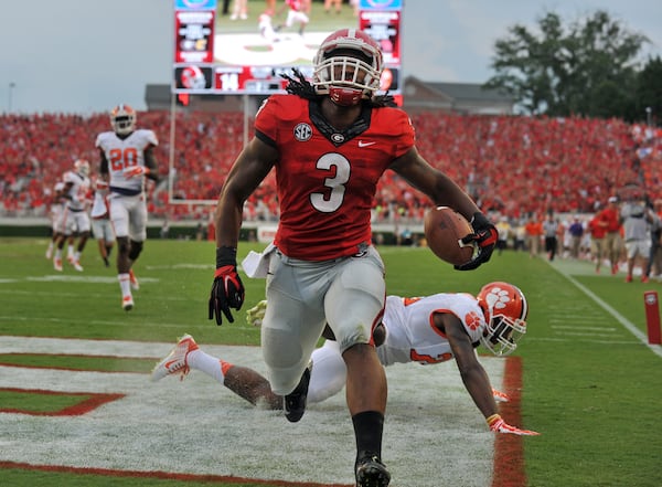 August 30, 2014 Athens, GA: Georgia Bulldogs running back Todd Gurley scores on 100-yard kickoff return against Clemson during the first half Saturday August 30, 2014 in Athens.  BRANT SANDERLIN / BSANDERLIN@AJC.COM 
.