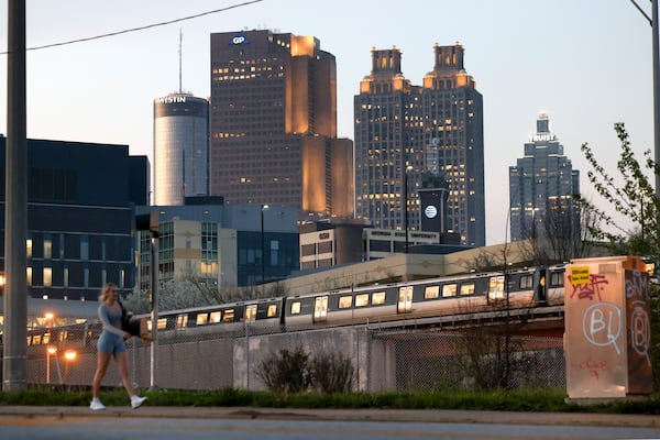 The Atlanta skyline is shown as a MARTA train leaves the Georgia State MARTA Station off of Piedmont Avenue on Monday, March 6, 2023, in Atlanta. Jason Getz / Jason.Getz@ajc.com)
