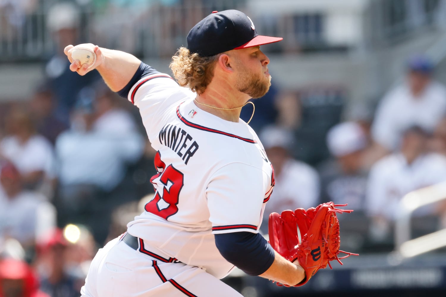 Atlanta Braves reliever A.J. Minter delivers during the eighth inning Sunday at Truist Park. (Miguel Martinez / miguel.martinezjimenez@ajc.com)