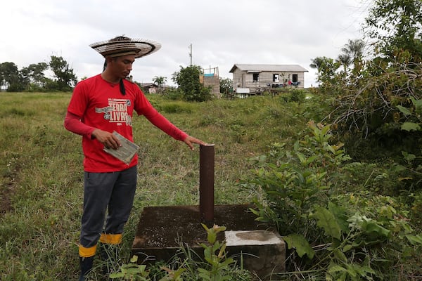 Indigenous leader Filipe Gabriel Mura shows an exploratory well for future drilling of potash, a mineral that includes potassium, in the Lago do Soares village, in Autazes, Amazonas state, Brazil on Feb. 18, 2025. (AP Photo/Edmar Barros)