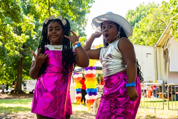 Sisters, Royal Z (left), and Zoey Fierce (right) practice their dance performance together at the Pure Heat Community Festival in Piedmont Park on Sunday, Sept. 1, 2024.  (Olivia Bowdoin for the AJC). 