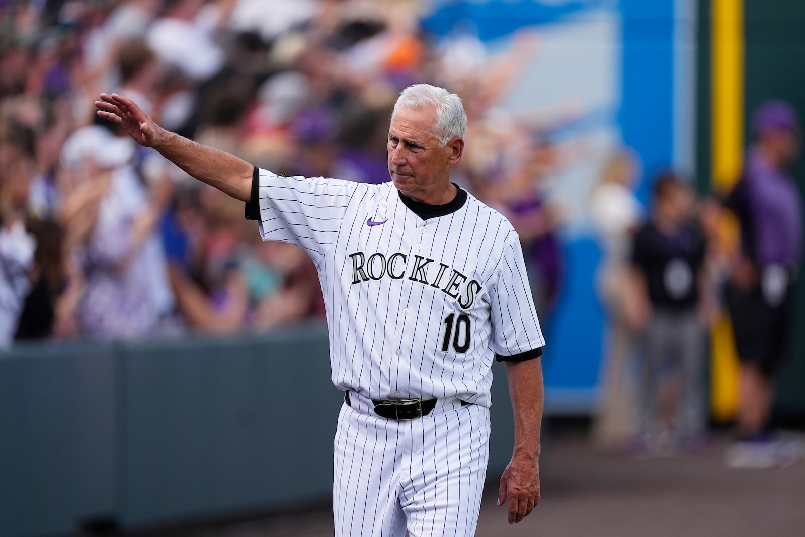 Colorado Rockies manager Bud Black waves during the team's ceremonial walk around the field to acknowledge fans following a loss in the team's season finale Sunday, Sept. 29, 2024, in Denver. (AP Photo/David Zalubowski)