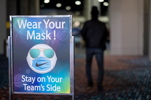 Organizers took coronavirus precautions at the Lil’ Big South volleyball tournament at the Georgia World Congress Center earlier this month, with signs posted reminding people to wear masks. (Ben Gray for The Atlanta Journal-Constitution)