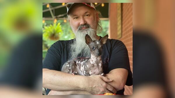 Matt Pruett and his dog, Chupacabra. He was discharged from the hospital Monday after being struck by gunfire Wednesday.