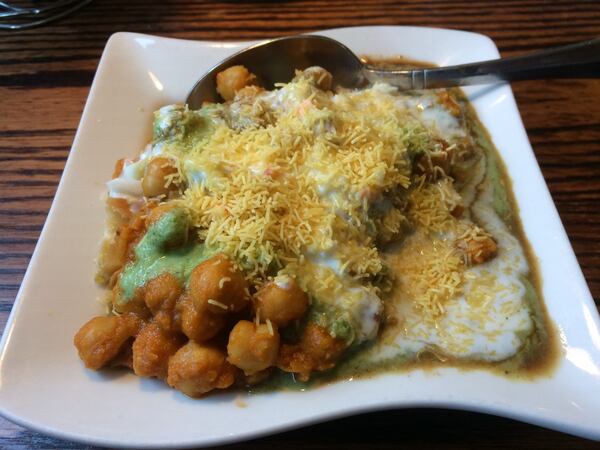  Pinch of Spice in Kennesaw offers some classic street food like this samosa chaat as appetizers.