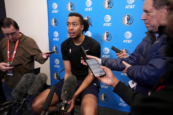 Dallas Mavericks newly-acquired player Moses Brown responds to question during a news conference after NBA basketball practice at the team's training facility in Dallas, Thursday, Feb. 20, 2025. (AP Photo/Tony Gutierrez)