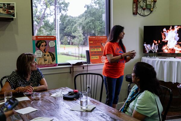 From left, community member Farha Ahmed; Sujatha Srikanth, a board member with South Asian Americans for Voter Empowerment of Texas; and Padma Srinivasan, a precinct chair in Fort Bend County, strategize how to engage South Asian voters on June 19, 2024, in Houston. (Photo by Eliana Alzate/News21)