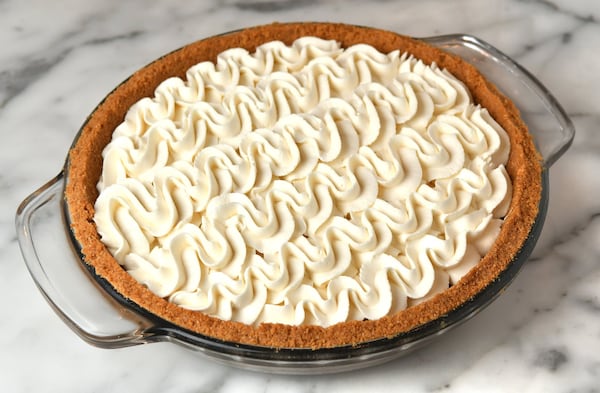 Earl Grey Latte Pie is topped with Vanilla Whipped Cream and has a strong dose of Earl Grey tea in the pie filling. STYLING BY PAUL ARGUIN AND CHRIS TAYLOR / CONTRIBUTED BY CHRIS HUNT PHOTOGRAPHY