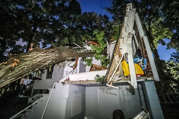 A tree fell on a house in the 2700 block of Grand Avenue as storms moved through southwest Atlanta around 11 p.m. Wednesday. Five people were taken to a hospital to be checked for injuries.