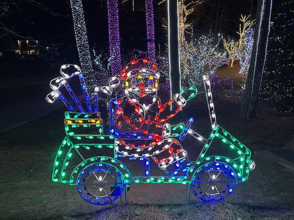 A golf-playing Santa is one of the many electric displays guests enjoy as they scoot around Lights of Joy. Courtesy of Richard Taylor