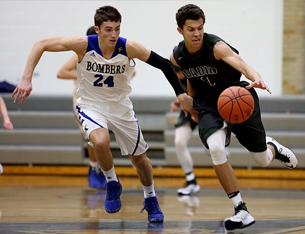 St. Xavier guard Matthew Budde pursues Badin forward Caleb Meyer during Tuesday night’s game at Berning Gymnasium in Springfield Twp. CONTRIBUTED PHOTO BY E.L. HUBBARD