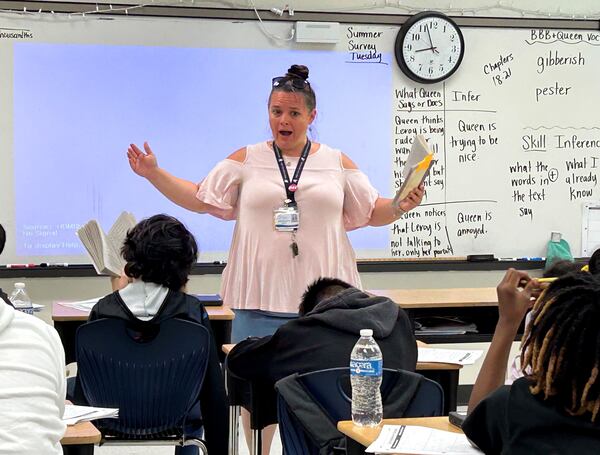 Fulton County teacher Jennifer Dallas works with a fifth grade class on making inferences using a book called "The Broken Bike Boy and the Queen of 33rd Street." Fulton is revamping its reading program to focus on the five pillars of literacy as defined by the National Reading Panel. (Martha Dalton/martha.dalton@ajc.com)