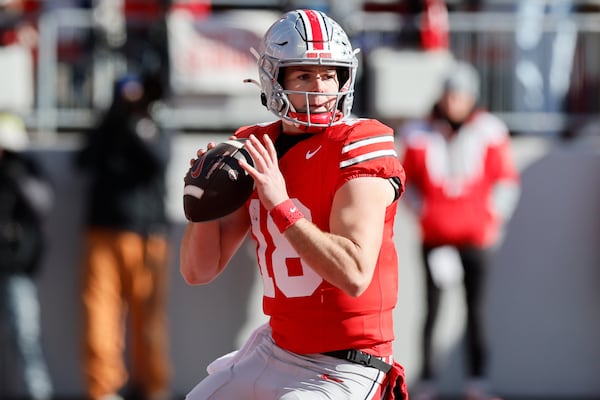 Ohio State quarterback Will Howard looks for an open receiver against Michigan during the first half of an NCAA college football game Saturday, Nov. 30, 2024, in Columbus, Ohio. (AP Photo/Jay LaPrete)