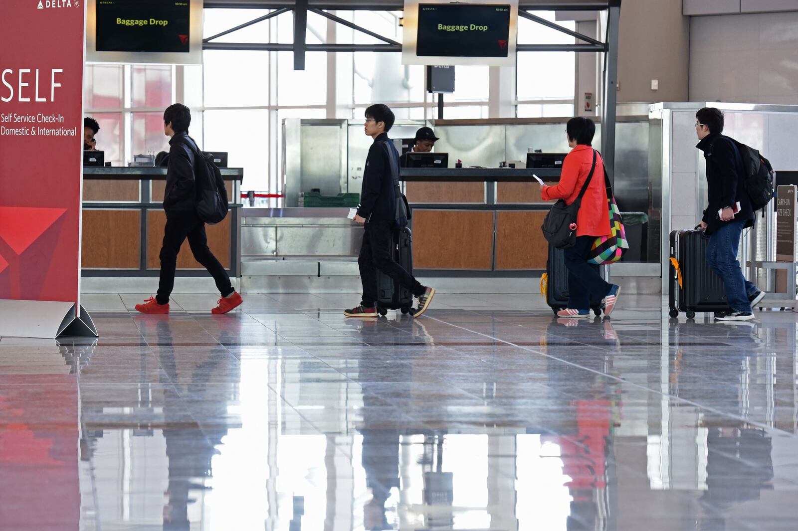 The number of travelers at Maynard H. Jackson Jr. International Terminal has been lower than originally projected, contributing to duty-free shops losing millions of dollars, the operator of the stores claims. HYOSUB SHIN / HSHIN@AJC.COM