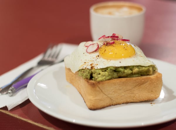 The avocado toast at Spiller Park is served on a thick slice of sourdough from H&F Bakery. CONTRIBUTED BY HENRI HOLLIS