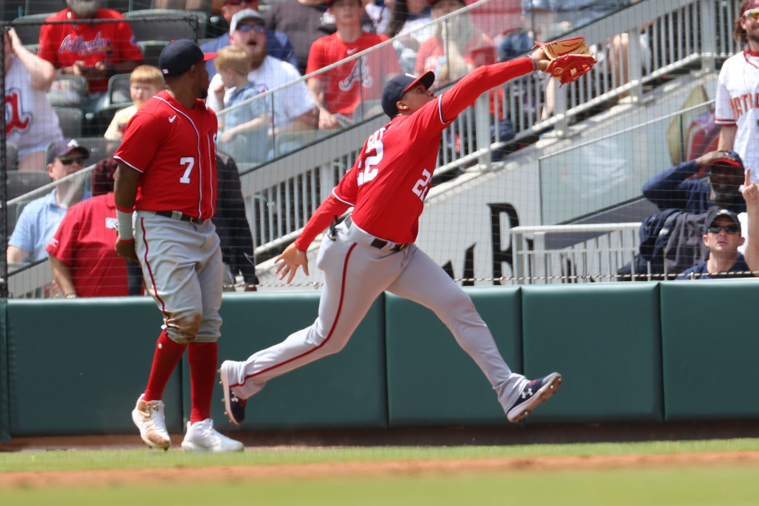 Nationals right fielder Juan Soto catches a ball during the third inning Wednesday at Truist Park. (Miguel Martinez/miguel.martinezjimenez@ajc.com)