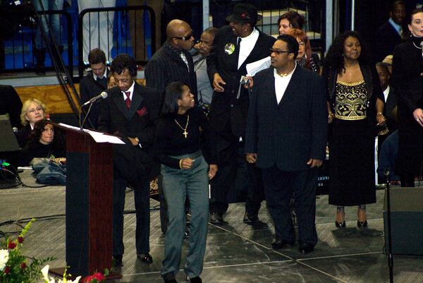 Venisha Brown, center, performed some dance moves at the funeral of her father, music legend James Brown, in December 2006. Venisha Brown died Wednesday.