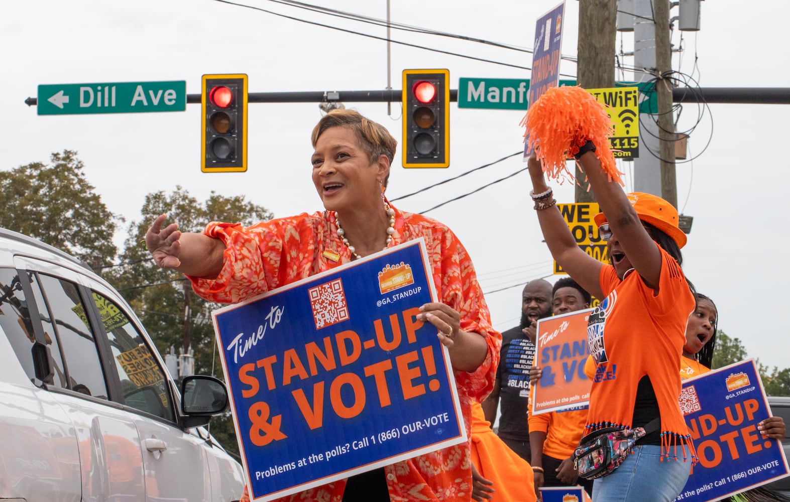 The last day of early voting in Georgia takes place at Metropolitan Library in South Fulton County; across the street several non-profit, non-partisan groups, including Deborah Scott, CEO of Georgia Stand Up, dance and cheer, provided free food, information and swag to encourage people to vote Friday, November 1, 2024.  The polling location had a steady stream of voters throughout the day.  (Jenni Girtman for The Atlanta Journal-Constitution)