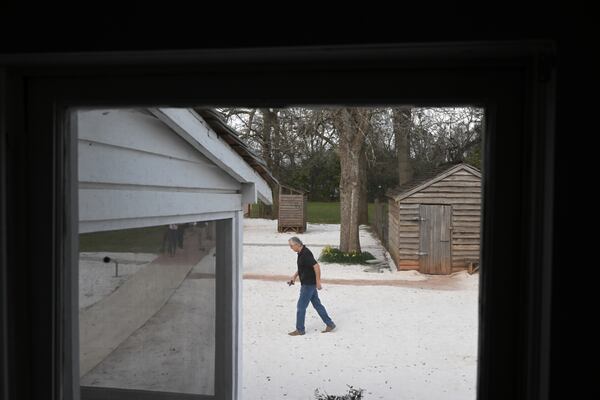 A visitor is seen framed in a portion of former president Jimmy Carter's boyhood home. (Washington Post photo by Matt McClain)