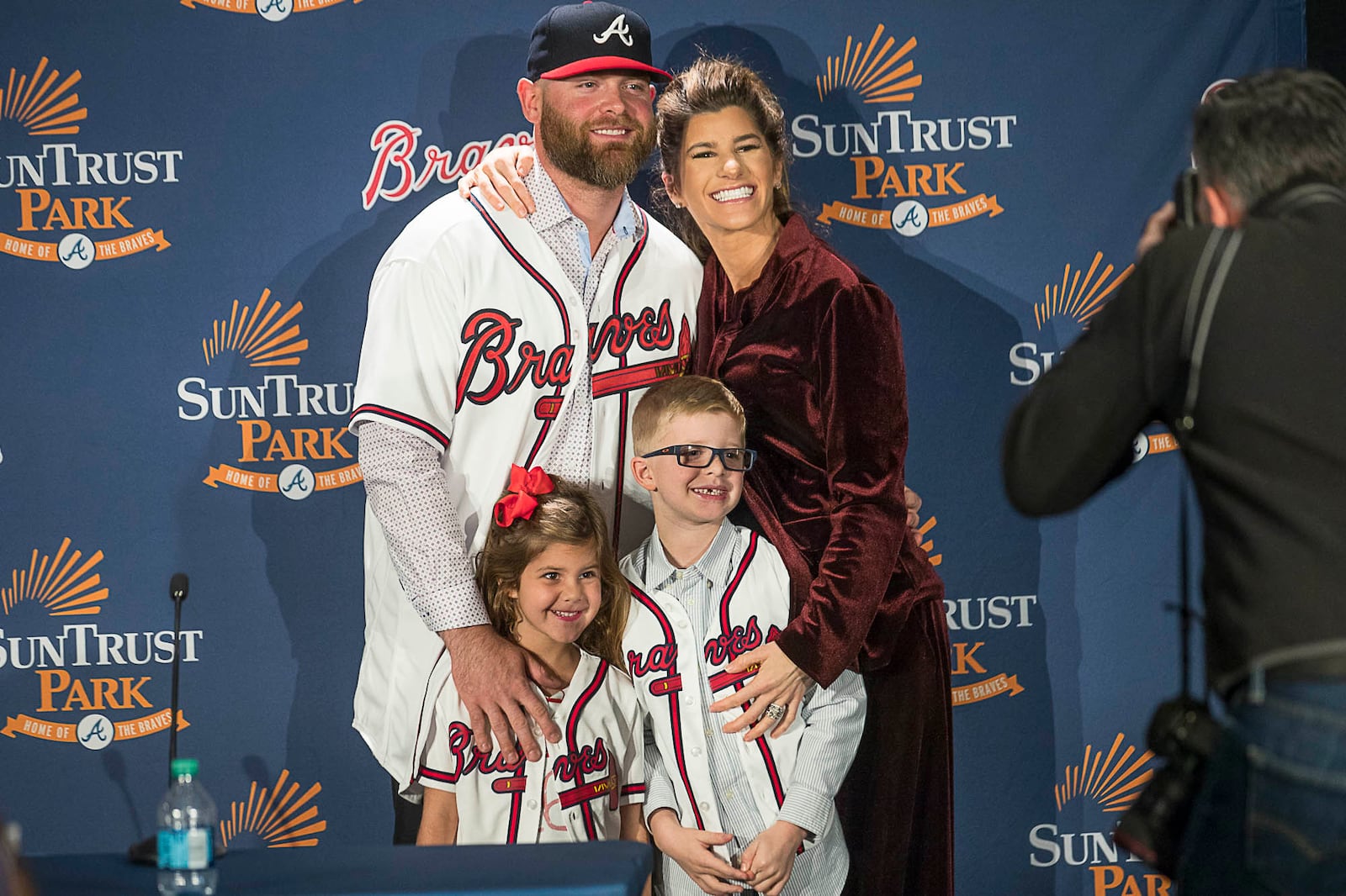 Brian McCann and wife Ashley pose for a photo with children Colt (right) and Colbie (left) following Monday's press conference. (Alyssa Pointer/Alyssa.Pointer@ajc.com)