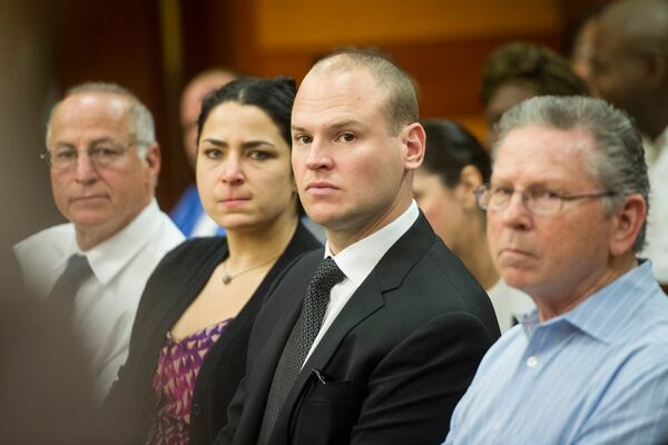 Former Atlanta Police Officer James R. Burns (center) in court on Monday, Aug. 1, 2016/ John Amis for the AJC