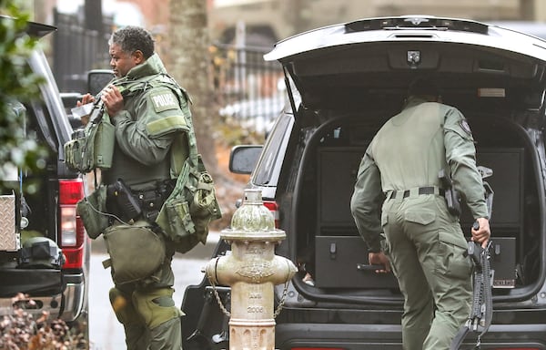 Atlanta police SWAT teams wrap up after responding to an apartment complex in southwest Atlanta around 2 a.m. Wednesday. 