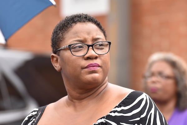 Tamara Cotman, who was convicted in the Atlanta Public Schools test-cheating case, reacts before she turns herself in outside the Fulton County Jail in Atlanta on Tuesday, October 9, 2018. AJC file photo. HYOSUB SHIN / HSHIN@AJC.COM