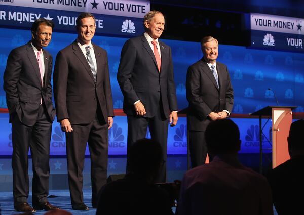 BOULDER, CO - OCTOBER 28: Presidential candidates Louisiana Governor Bobby Jindal (L-R), Rick Santorum, George Pataki, and Sen. Lindsey Graham (R-SC) take the stage for the CNBC Republican Presidential Debate at University of Colorado's Coors Events Center October 28, 2015 in Boulder, Colorado. Fourteen Republican presidential candidates are participating in the third set of Republican presidential debates. (Photo by Justin Sullivan/Getty Images)